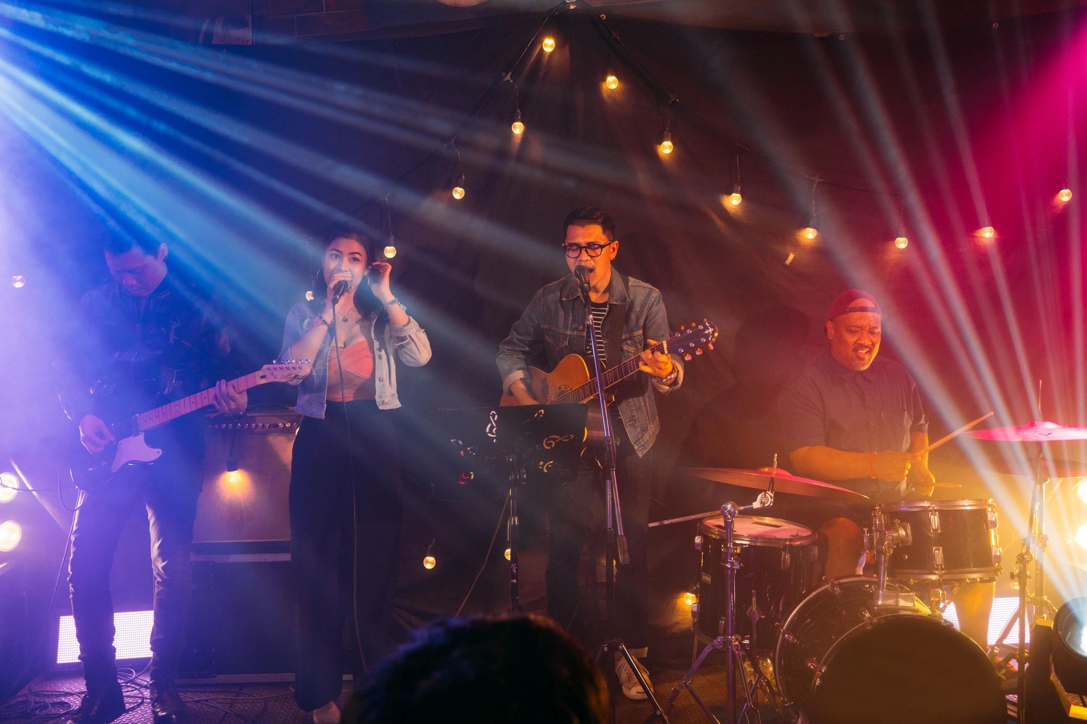 Music band performing on stage at the concert